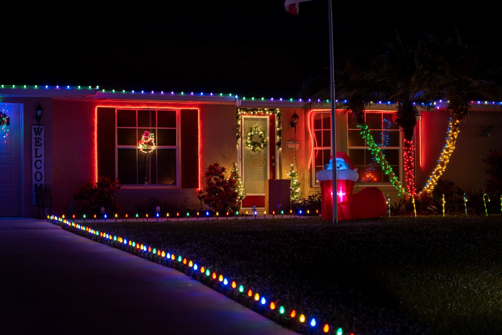 shining christmas lights on house