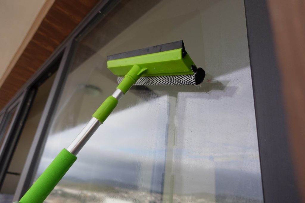 A rubber squeegee used for professional window cleaning.